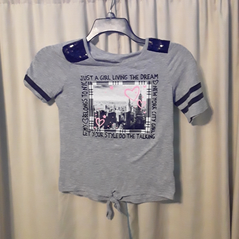 A gray Justice shirt